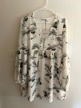 Glamorous White Dress with Bird Motif